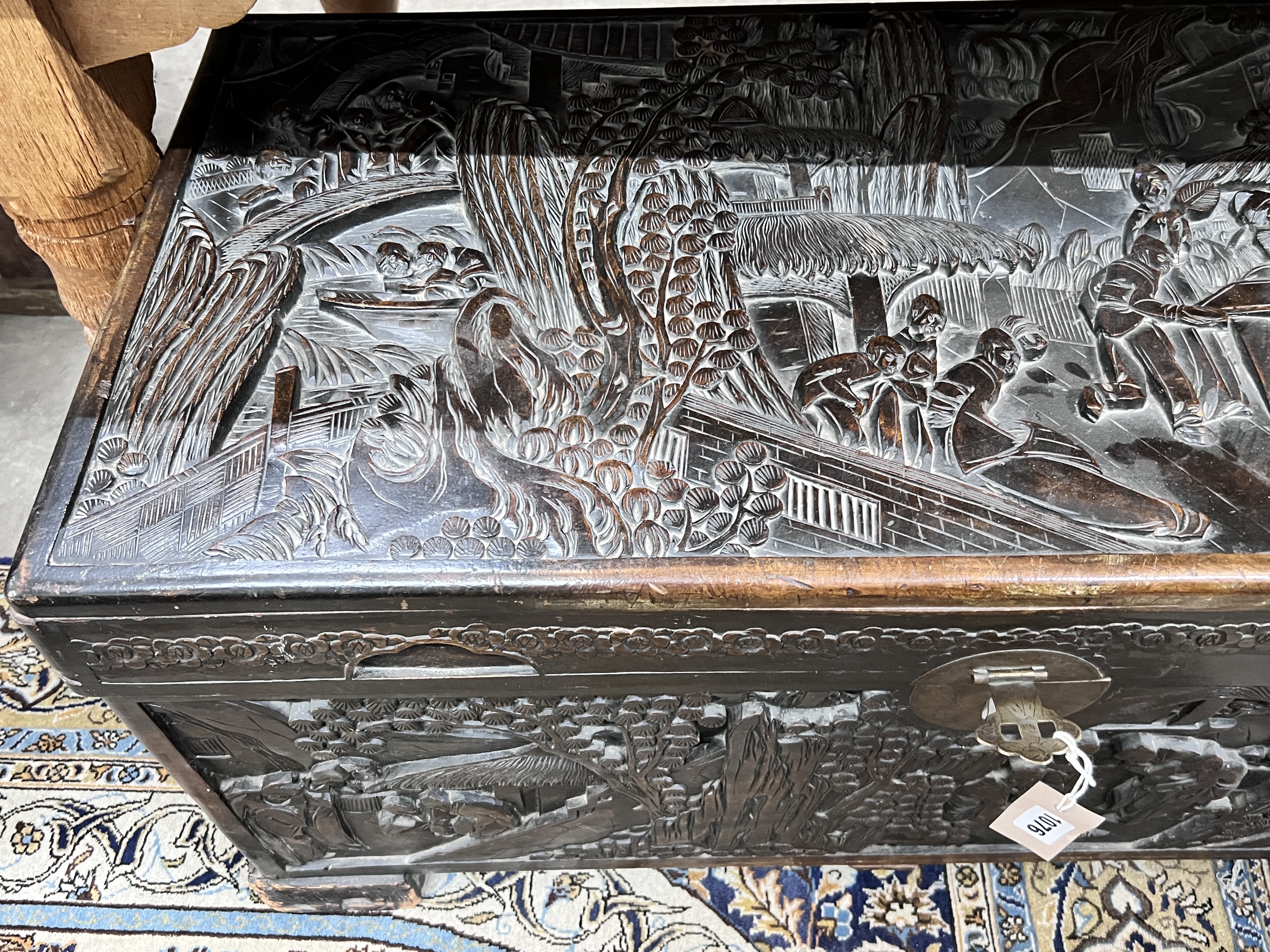 A Chinese carved camphorwood trunk, length 96cm, depth 48cm, height 50cm